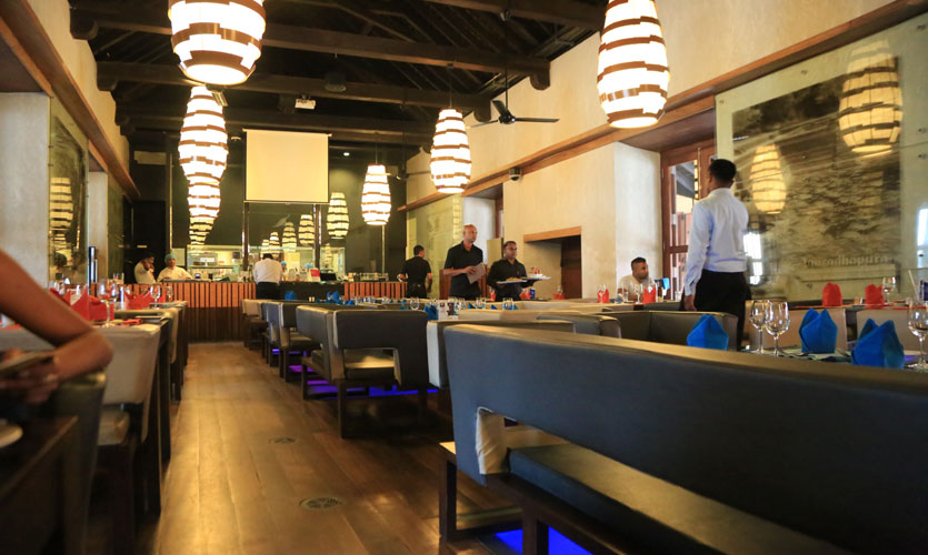 Indulge in local cuisine at the Old Dutch Hospital .